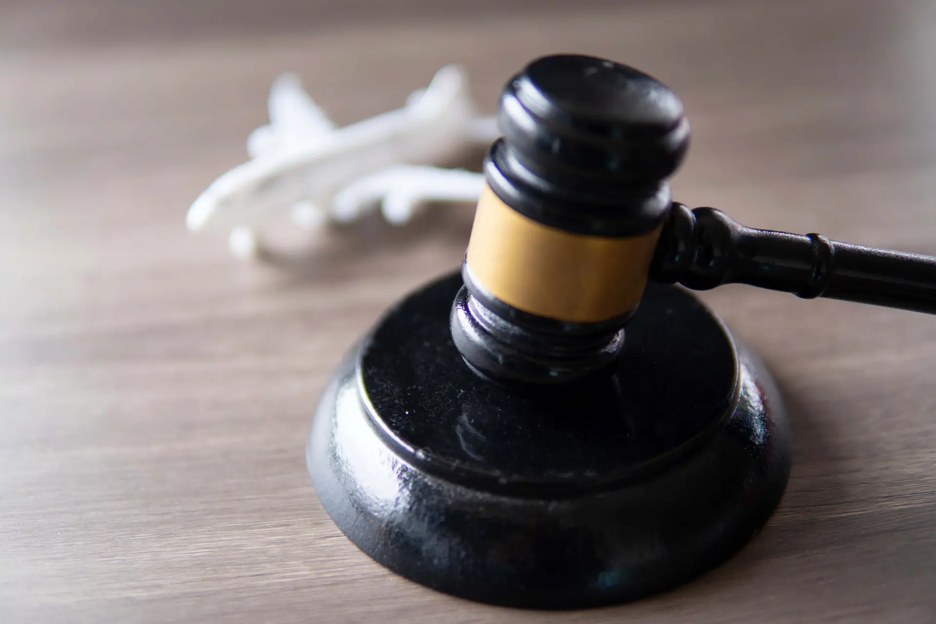 a gavel rests in front of an airplane