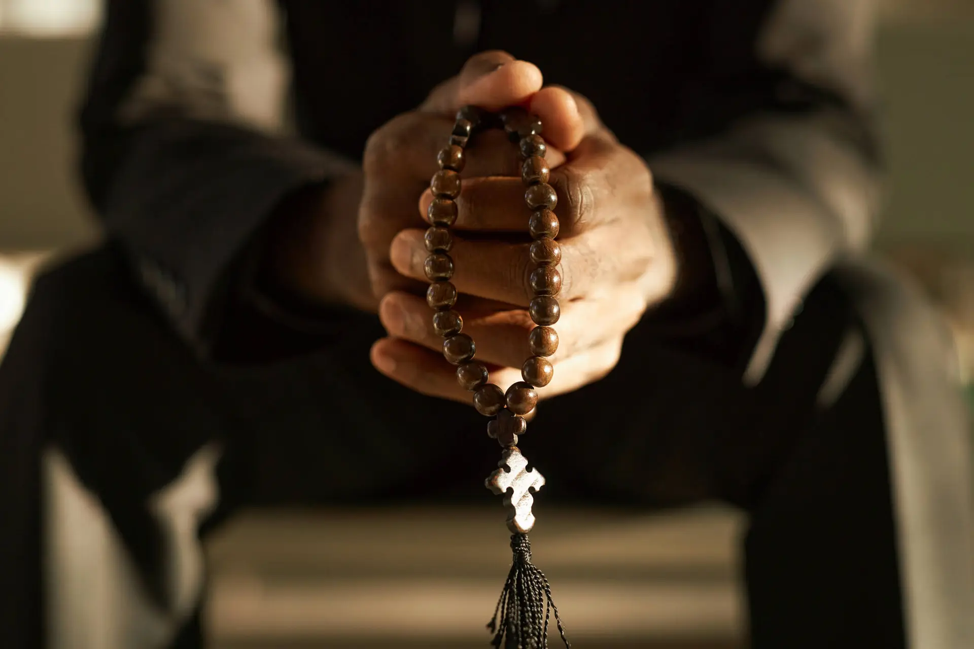 a priest holding a rosary