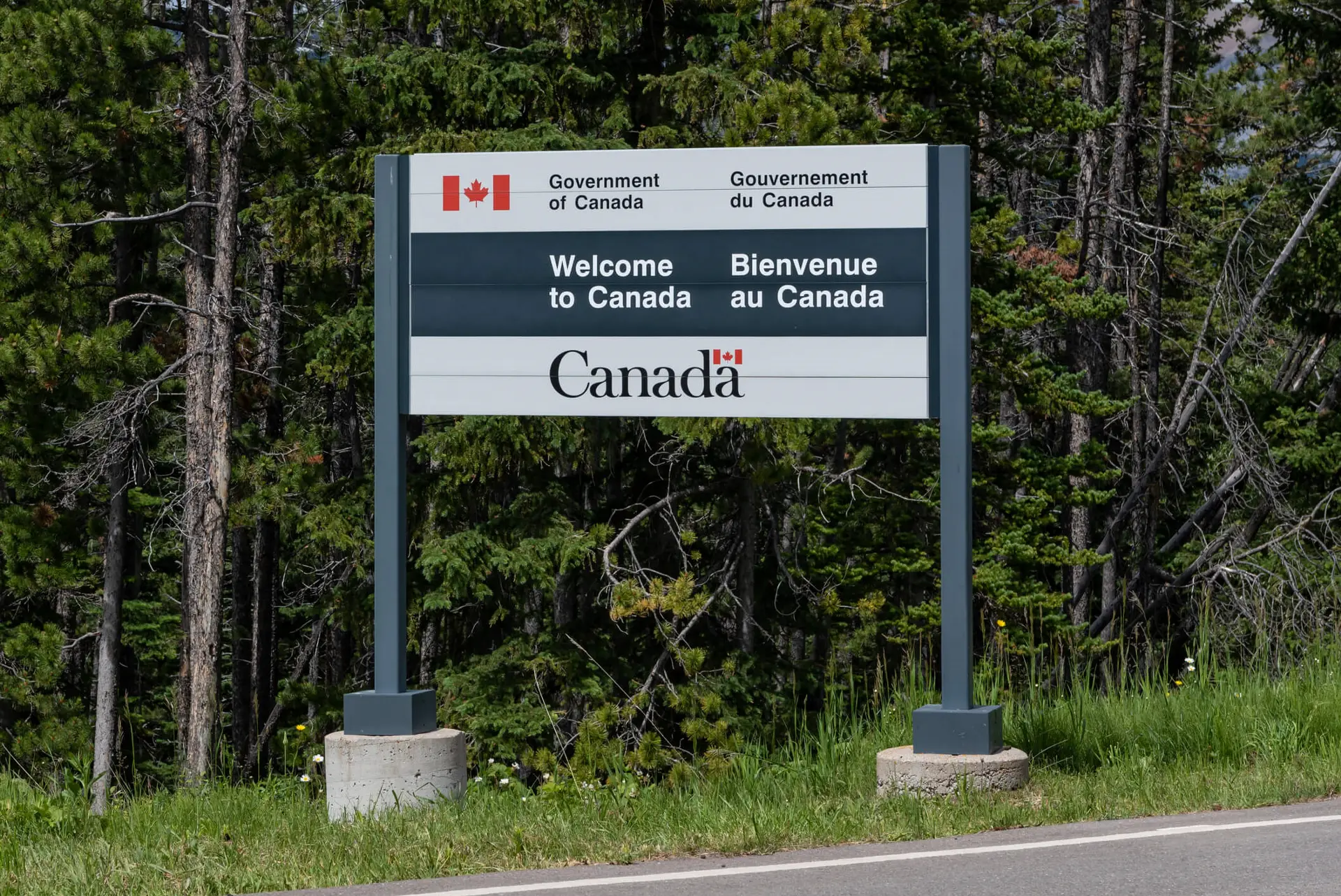 a border crossing sign reads "Welcome to Canada"