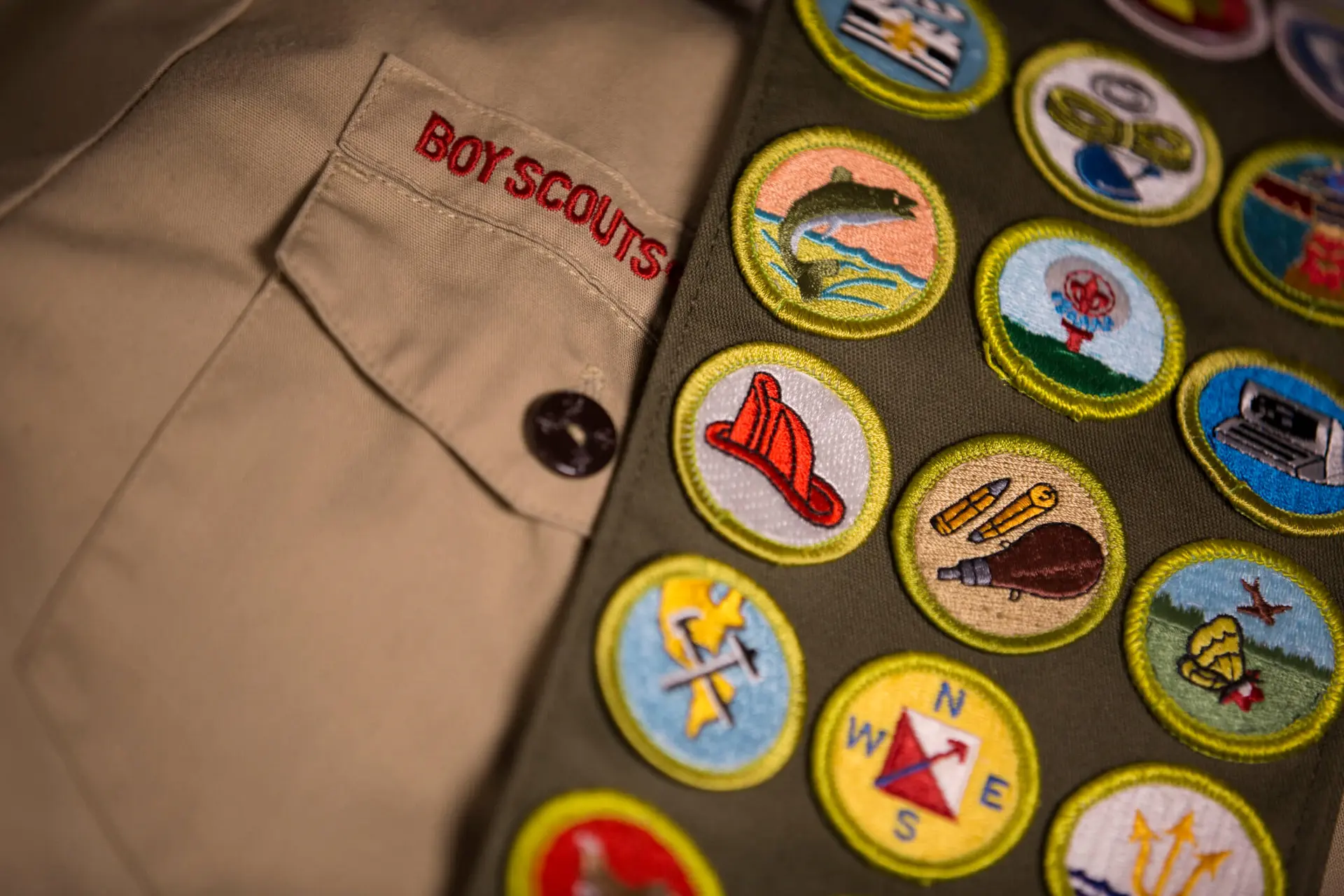 a boy scout's merit badges are displayed on a sash