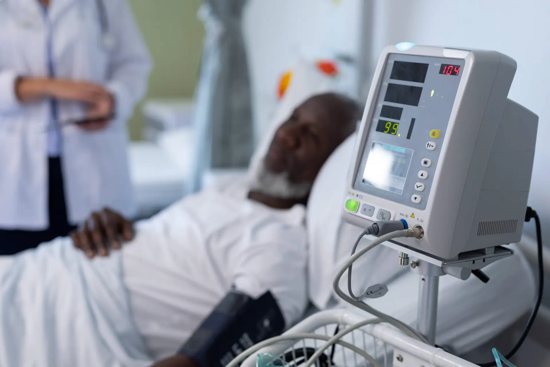 a man in need of medical attention lays in a hospital bed