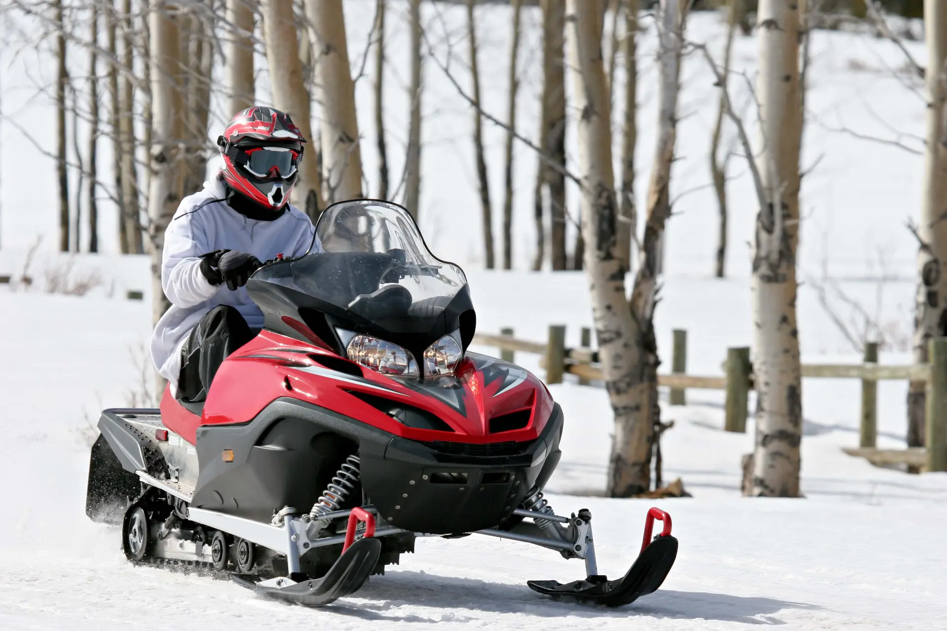 a person heads out on a read snowmobile in Barrie