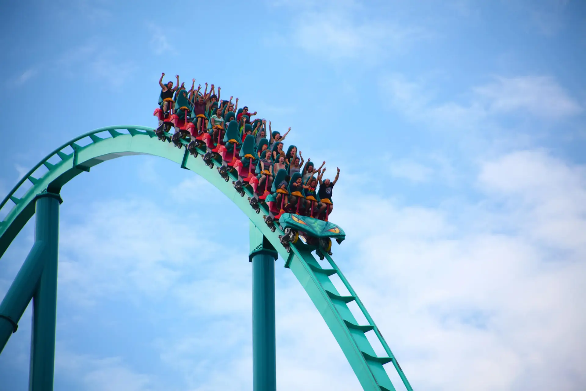 people enjoy a ride on a rollercoaster