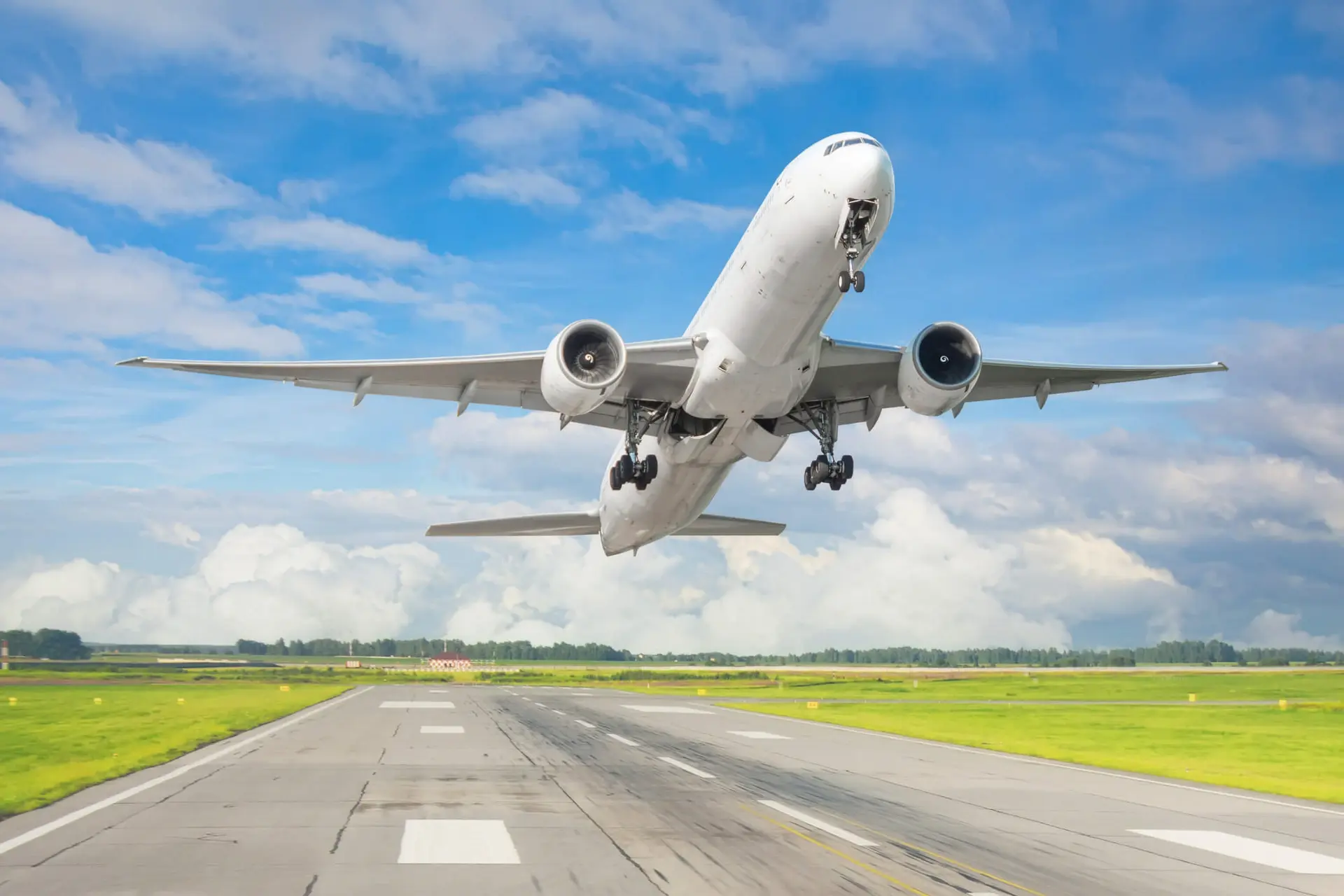 a plane taking off from the tarmac on an outbound flight