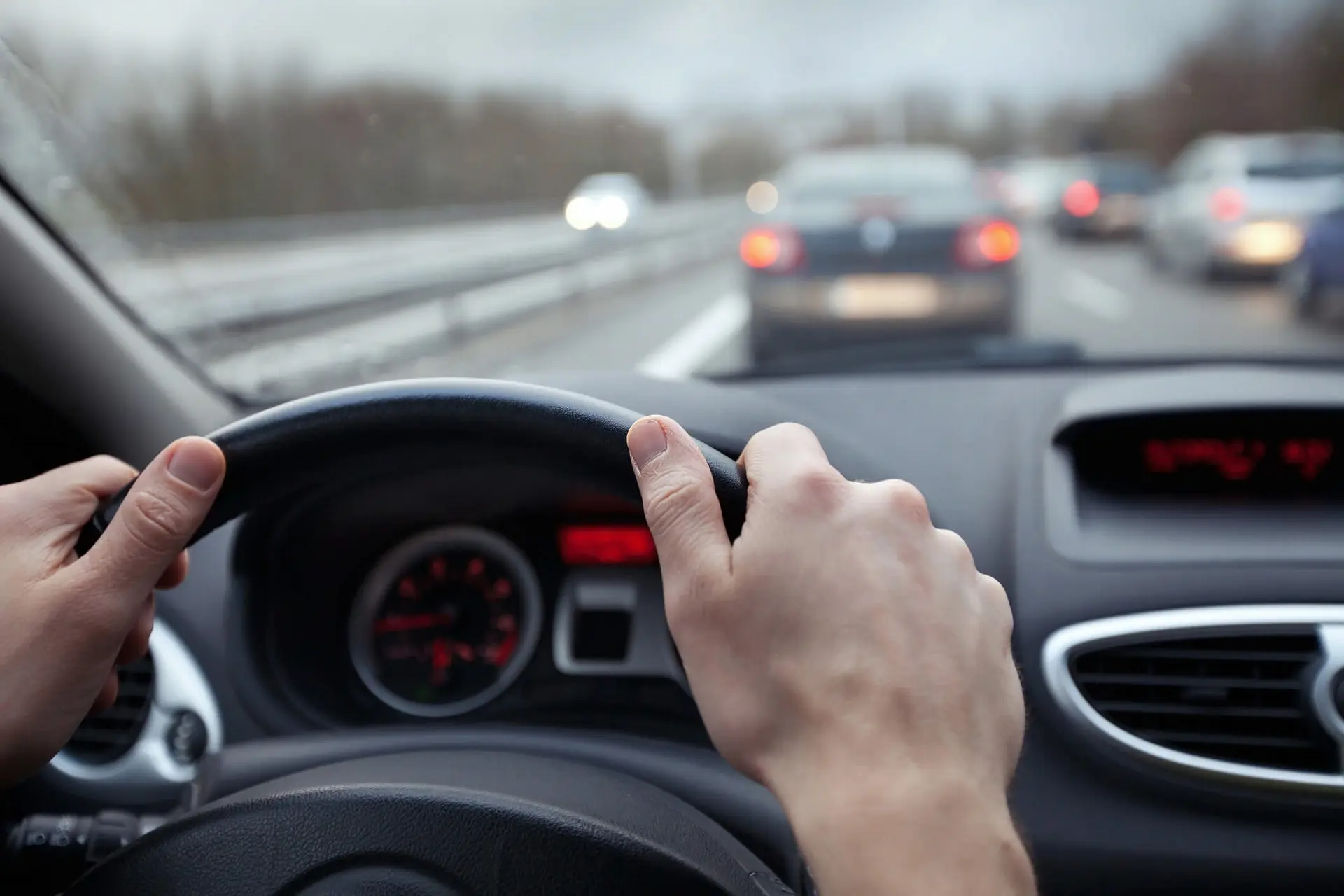 a person drives on a busy highway during the holiday season