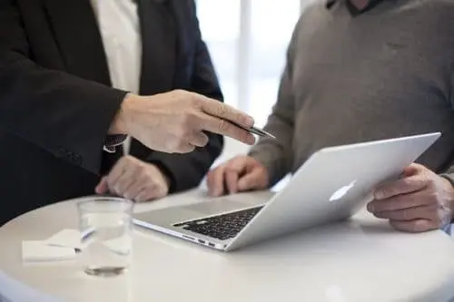 man-pointing-at-laptop